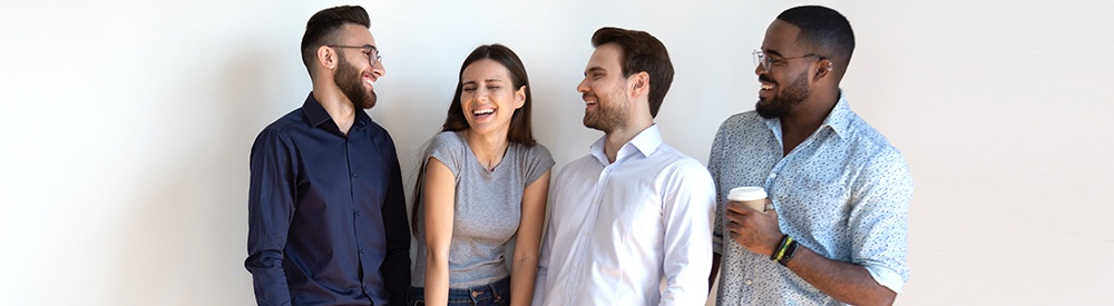 Photo of young professionals laughing and smiling