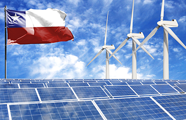 Image of the Chile flag next to wind turbines and solar panels
