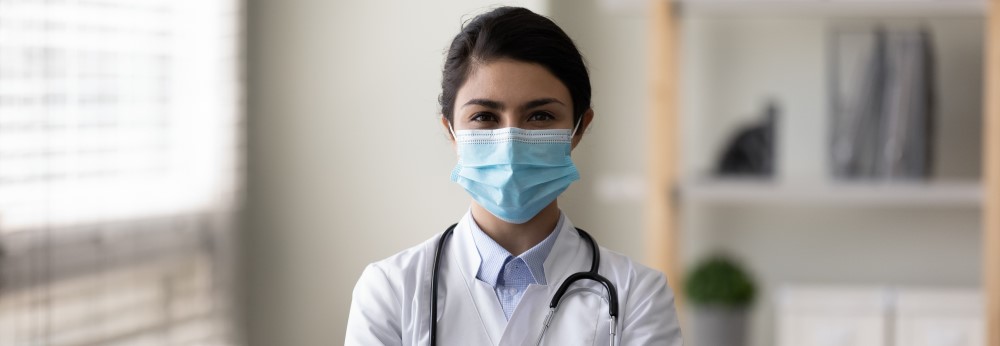 Patient inhaling oxygen wearing mask with liquid Oxygen flow