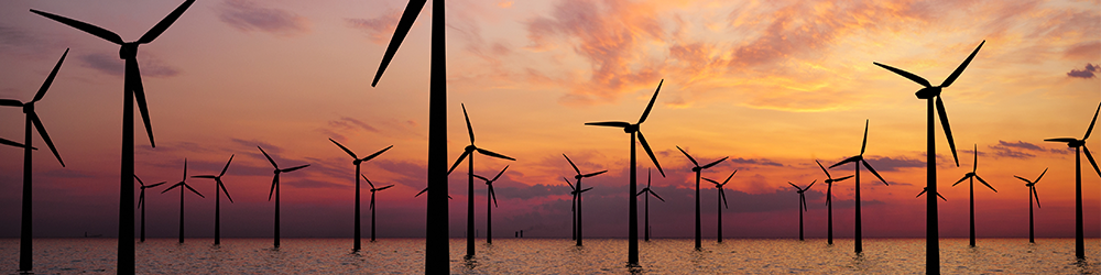 Photo of Offshore Wind Turbines Farm at sunset